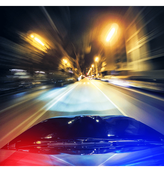 A perspective view of a police car in a high speed chase