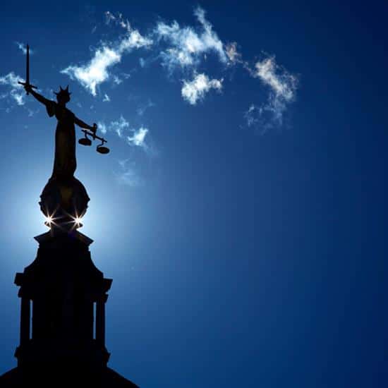 Lady Justice Statue in silhouette