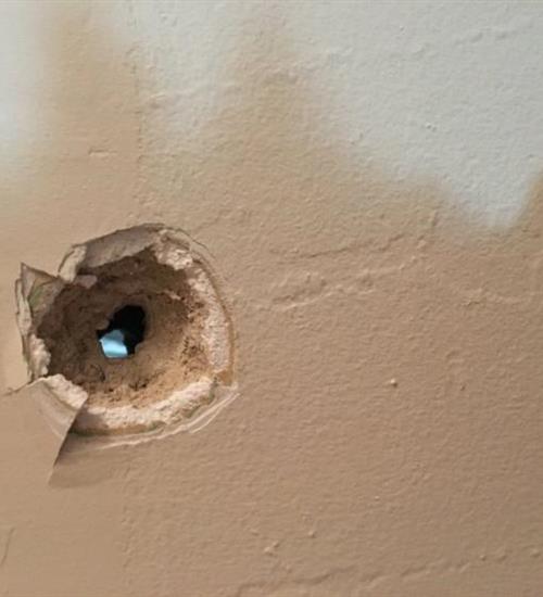 Bullet hole in a wall
