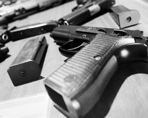 Guns on a desk as evidence